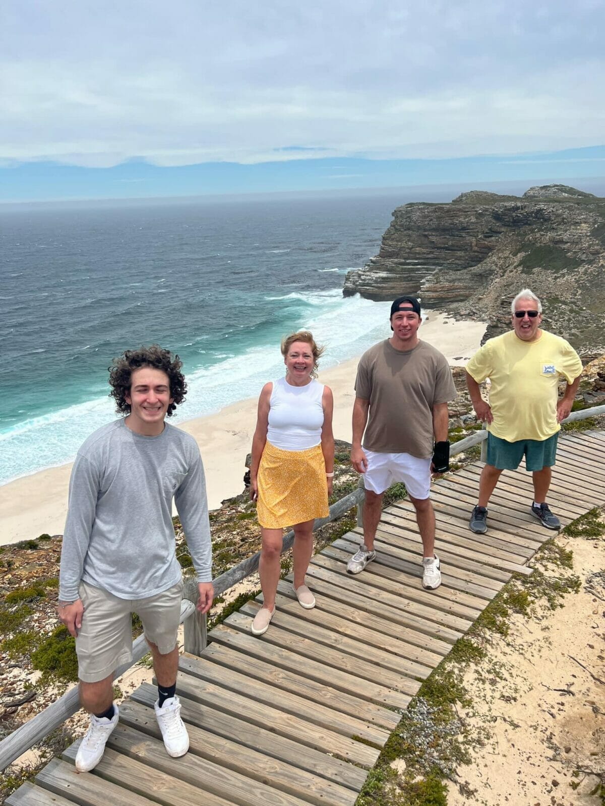 family with ocean behind
